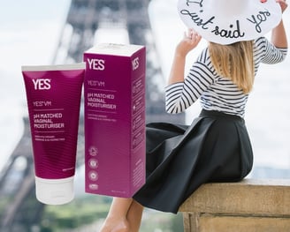 Woman in Paris, with a box of Yes moisturiser next to her.