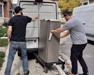 two men moving a filing cabinet into a van