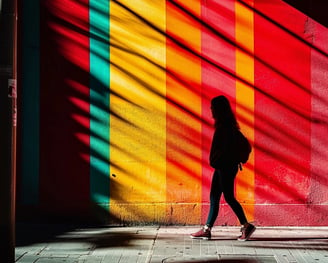 Peter Pickering's rendition of a girl walking down a sidewalk past a rainbow coloured striped wall