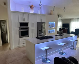 Custom kitchen renovation with granite countertops, upgraded flooring, and recessed lighting by FC I
