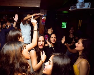 a group of people standing around a party