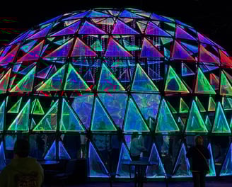 photographer night picture of a large dome shaped structure with colorful lights