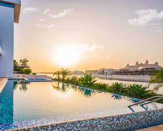 Luxury villa at Palm Jumeirah during sunset, showcasing Altessa's property management services