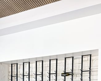 a wall of glasses with a bunch of glasses on it