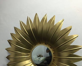 a Brass sunflower with a mirror