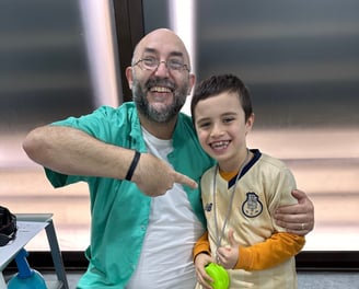 a man and a boy are posing for a picture