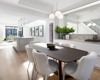 Modern dining room with custom joinery bar cabinets, oak flooring, dining table in renovated home
