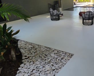 white polyaspartic topcoat in matte finish applied on exterior concrete breezeway