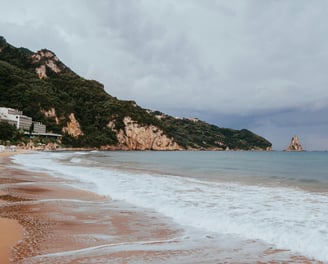 a beach with a boat in the water