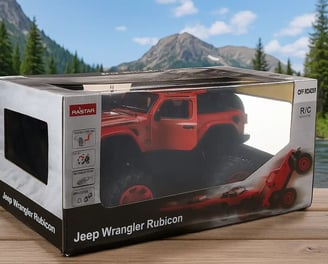 Jeep Rubicon en caja con fondo de montañas