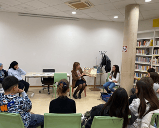 a group of people sitting in chairs in a room