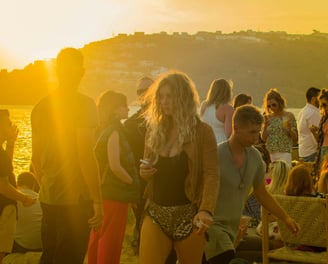a group of people standing around a table