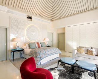 Master suite in the guest house of Villa El Rincon, Marbella, featuring stunning garden and sea views.