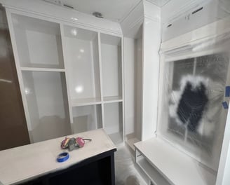 Custom refinished white built-in closet with a smooth, professional finish, enhancing storage space 