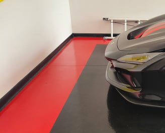 Black and red solid color epoxy garage floor with red border