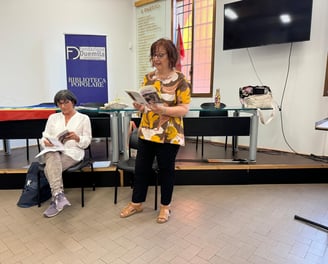 a woman in a yellow dress is reading a newspaper