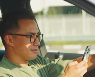 a man in holding a cell phone