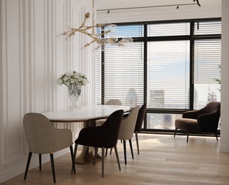 a dining room with a table and chairs