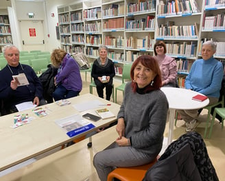 a group of people sitting around a table