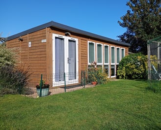 view of the outside of the salon, with beautiful blue sky