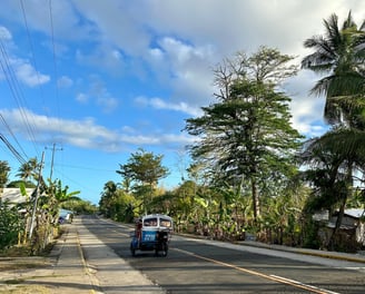 Siquijor island road with tricycle or tuktuk driving 