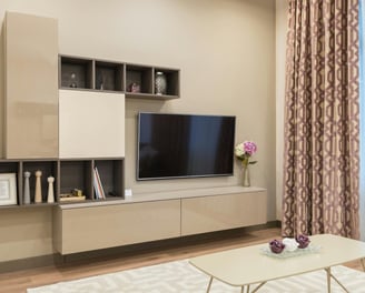 a living room with a television and a couch