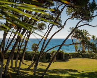 Expansive garden and sea views from the guest house at Villa El Rincon in Marbella.