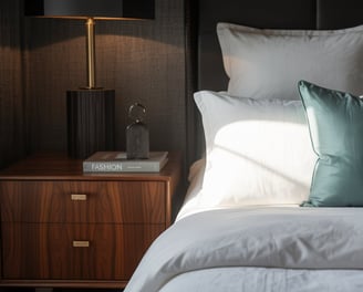 a bed with pillows and pillows on top of a bed