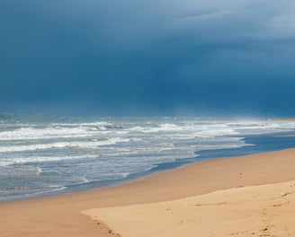 a beach with a boat in the water