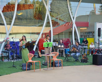 a band playing music in a large outdoor area