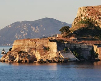 a boat is docked in front of a castle