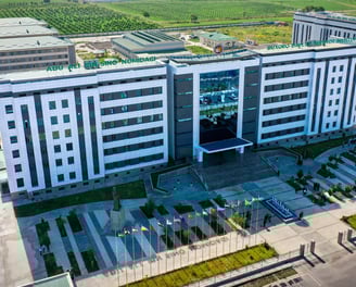 a large building with a large building in the background