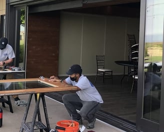 technician replacing sliding door rollers wooden sliding door roller repair 