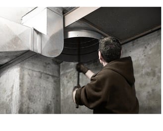A guy cleaning chute