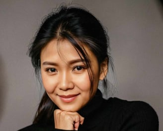a woman in a black sweater and white pants