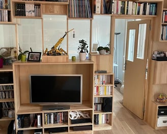 a living room with a television and a television