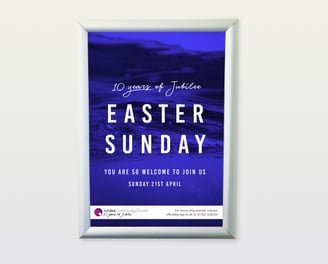 Framed Easter Sunday event poster for Jubilee Community Church with a blue water background,.