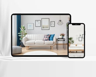 A tablet and smartphone displaying a virtually staged living room with modern furniture and decor