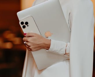 a woman in a white suit and a white jacket