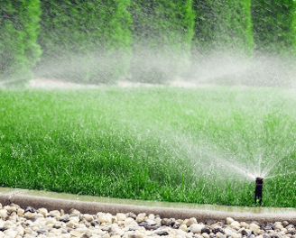 a sprinkler sprinkler sprinkles in the grass