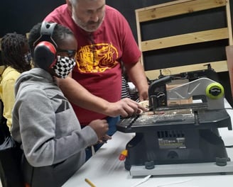 Teaching youth to carve wood using power tools