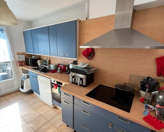 a kitchen with a stove top oven and a stove top