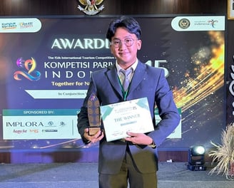 a man in a suit and tie holding a plaque