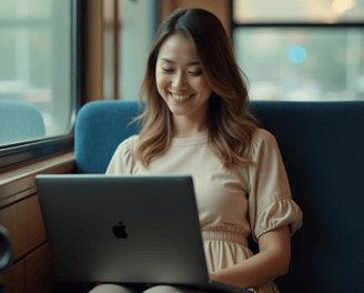 a woman sitting on a couch with a laptop computer