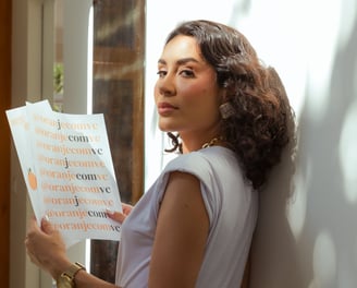 a woman in a white shirt and black pants