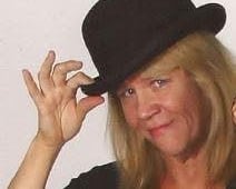 a woman in a black top hat and a black top hat