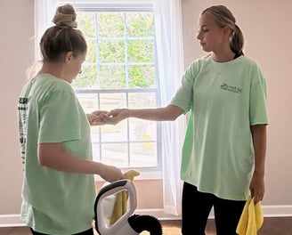 Two professional cleaners provide move-out cleaning services