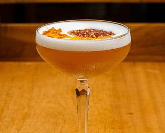 a glass of cocktail