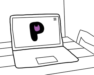 laptop drawing on table with purrsonal logo on screen