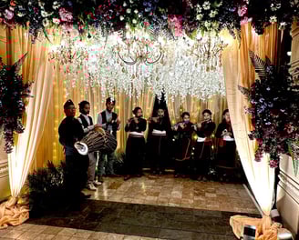 Newari folk instrumentalists performing live in a reception gate for a wedding